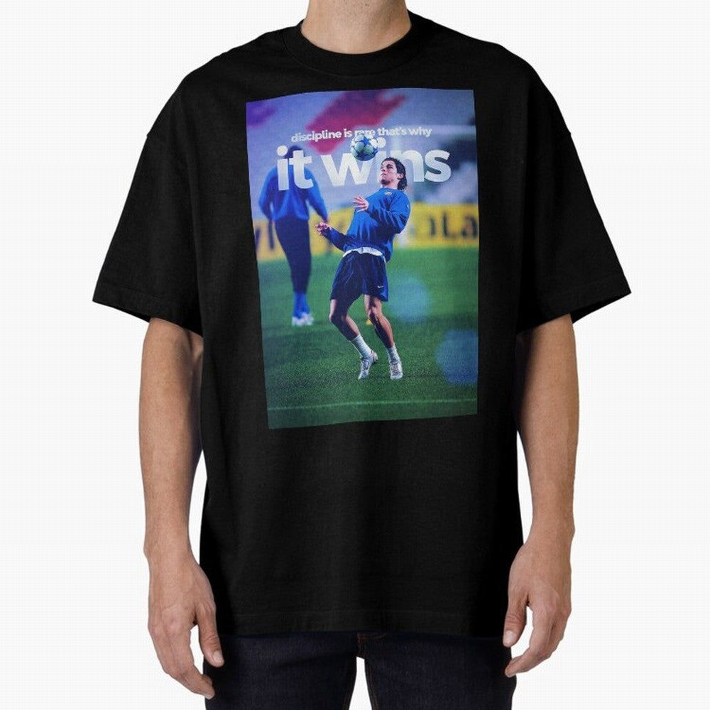 Cristiano Ronaldo - Discipline is rare that's why it wins Oversized T-Shirt Celebrate the Magic of Match Day Hype around FIFA World Cup 2026, Haaland and Mbappe, Netherlands, Retro Football Energy, Iconic Rivalries, Trophy Chase Drama and Stadium